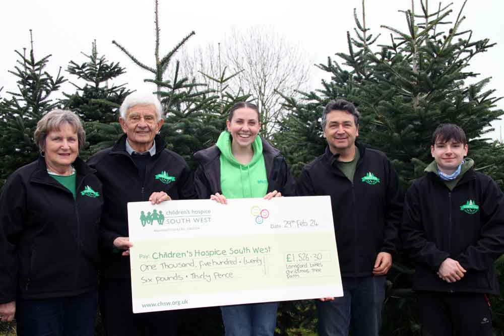 Langford Lakes team with a large cheque for CHSW