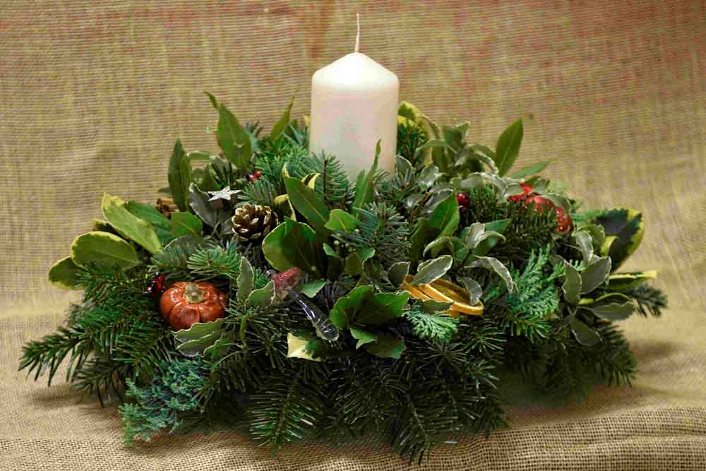 A handmade fresh Christmas table centrepiece