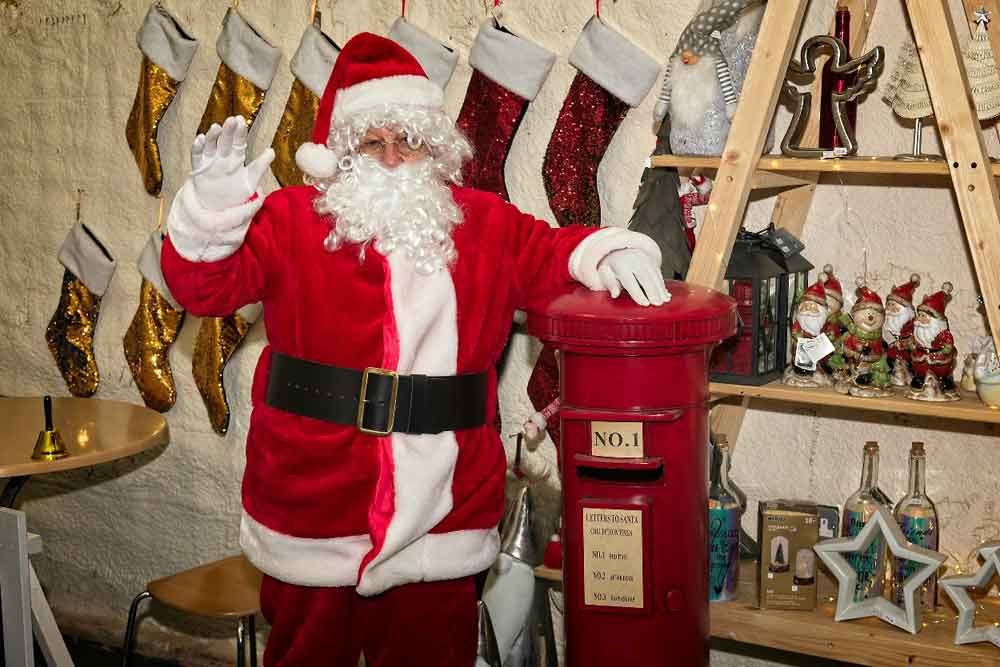 Father Christmas next to our festive postbox at Langford Lakes Christmas Tree Farm