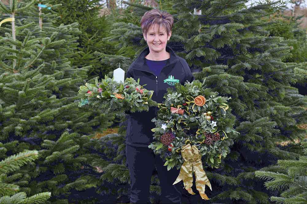 Trudy Hendy with a fresh home made Christmad wreath and a table decoration